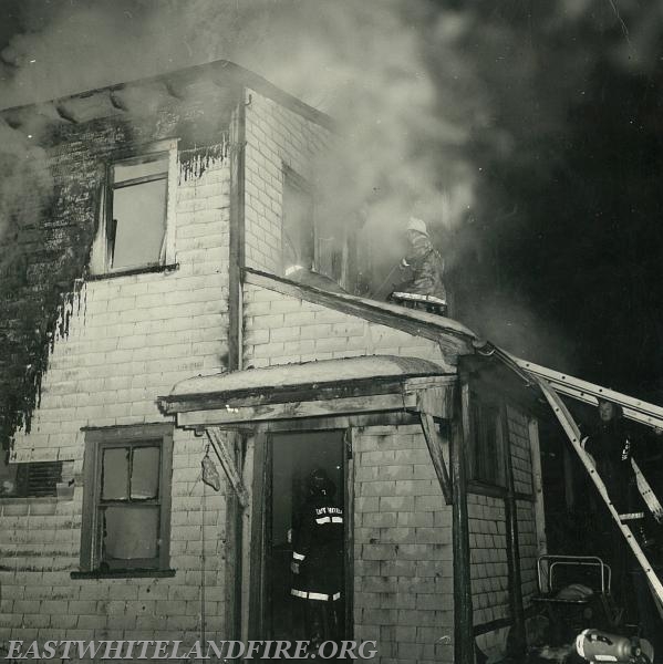 Apartment building fire with rescue of 31 occupants, December 1966. Morehall Road at the Morelli property. Jim Cockerham on roof and Alan Pinkerton on ladder.